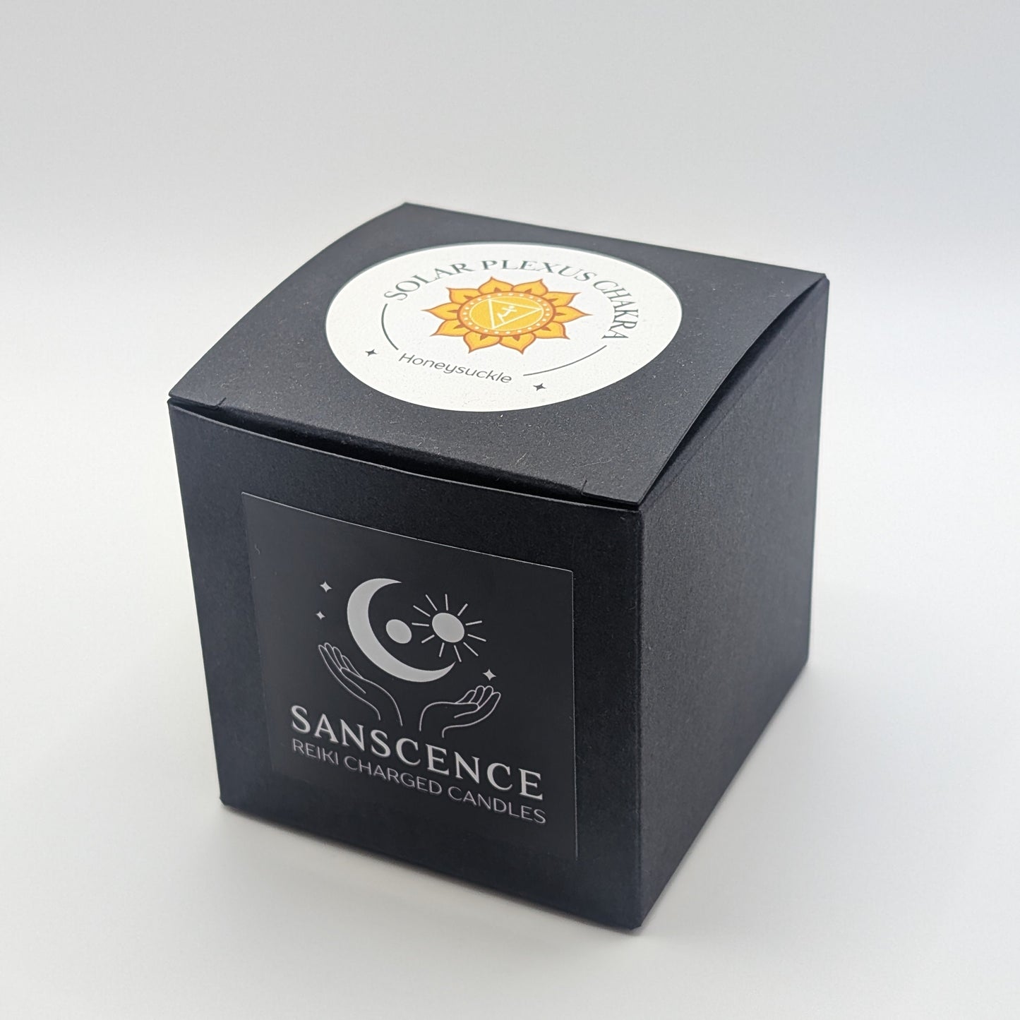 Black candle box with 'Sanscense' branding on a white background