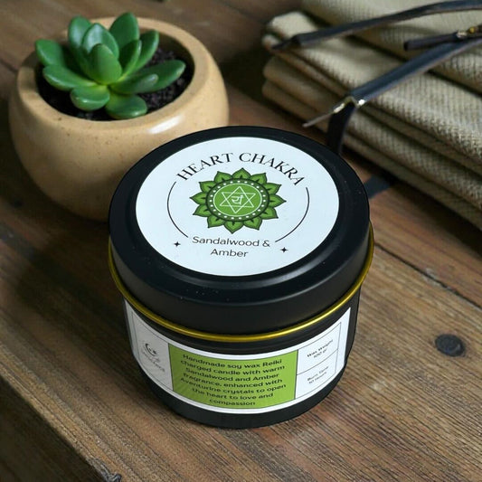 Jar of heart chakra product on a wooden surface with plants in the background