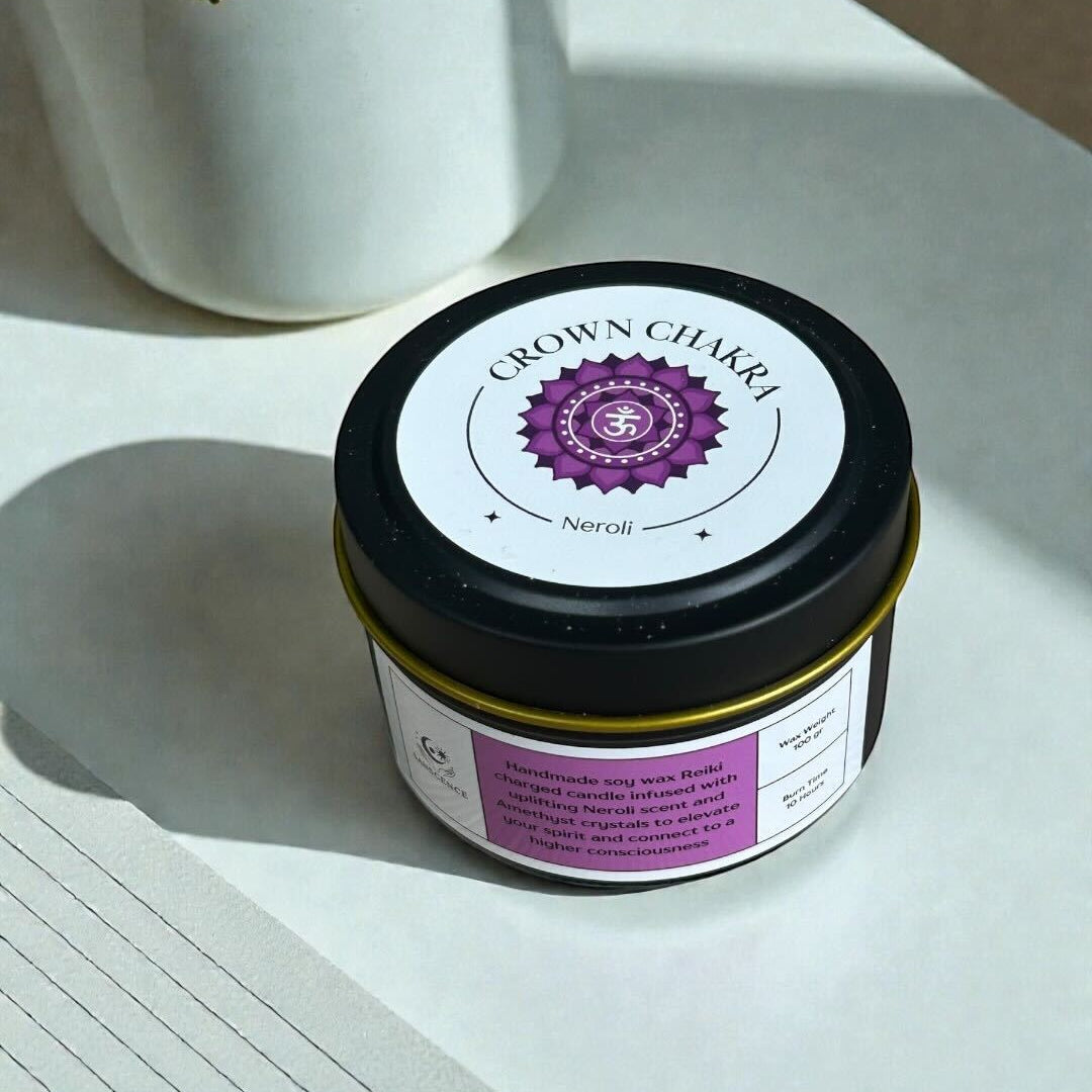 Jar of Crown Chakra product on a white surface with a plant in the background
