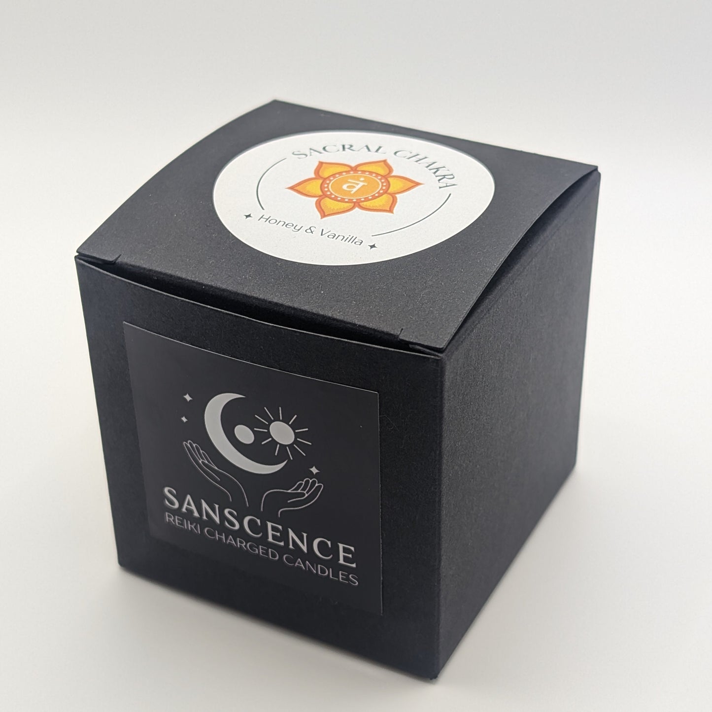 Black candle box with 'Sanscense' branding on a white background