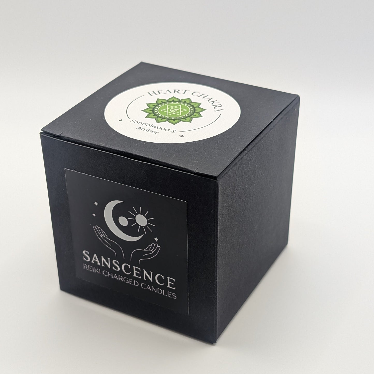 Black candle box with 'Sanscience' branding on a white background