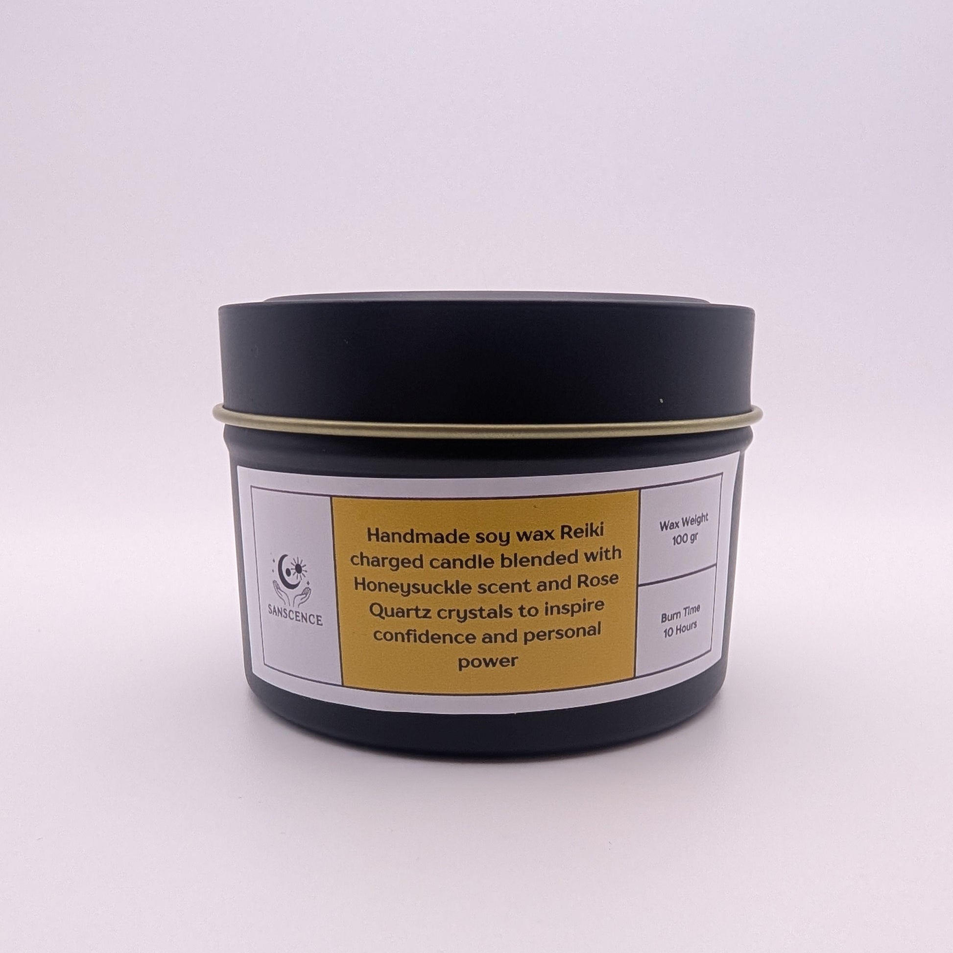 Handmade soy wax candle in a black container with a label on a white background