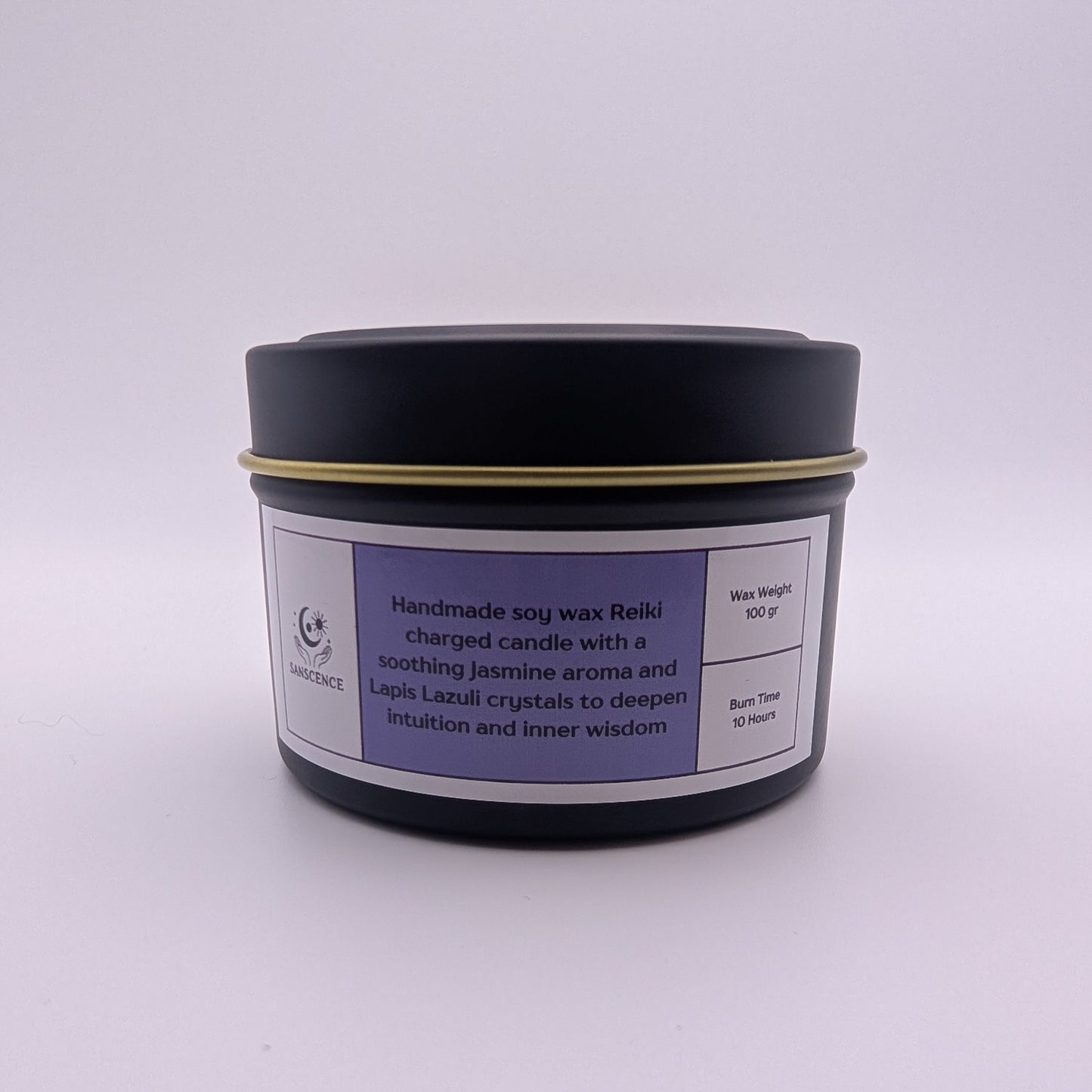 Black candle jar with a purple label on a white background