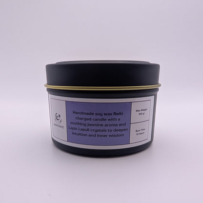 Black candle jar with a purple label on a white background