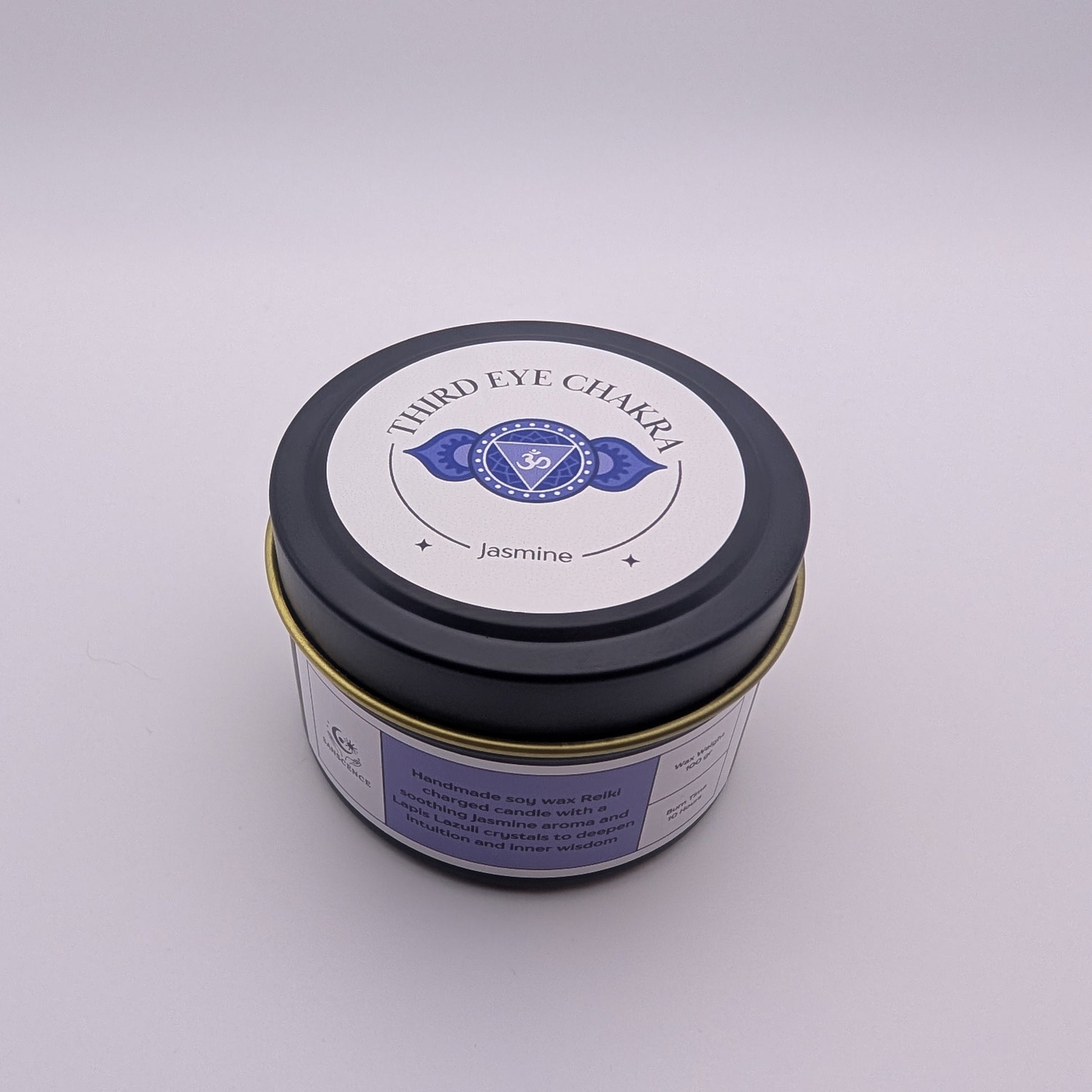 Jar of Third Eye Chakra candle on a white background