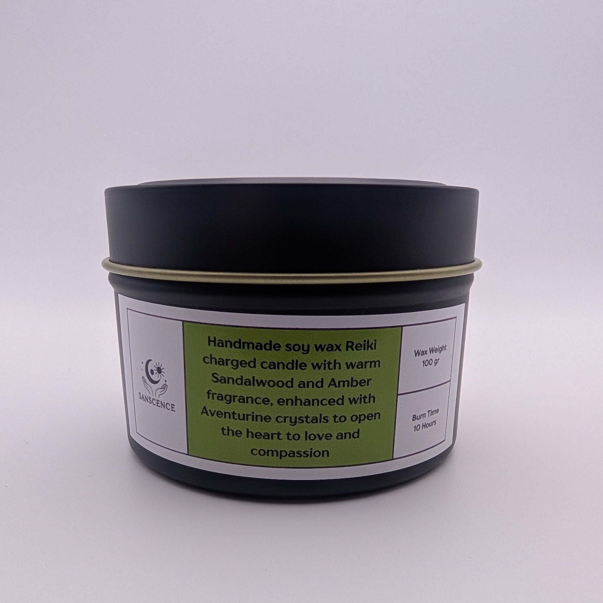 Black candle jar with a label on a white background