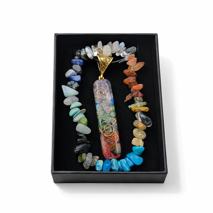 Colorful beaded necklace with a pendant in a black box on a white background