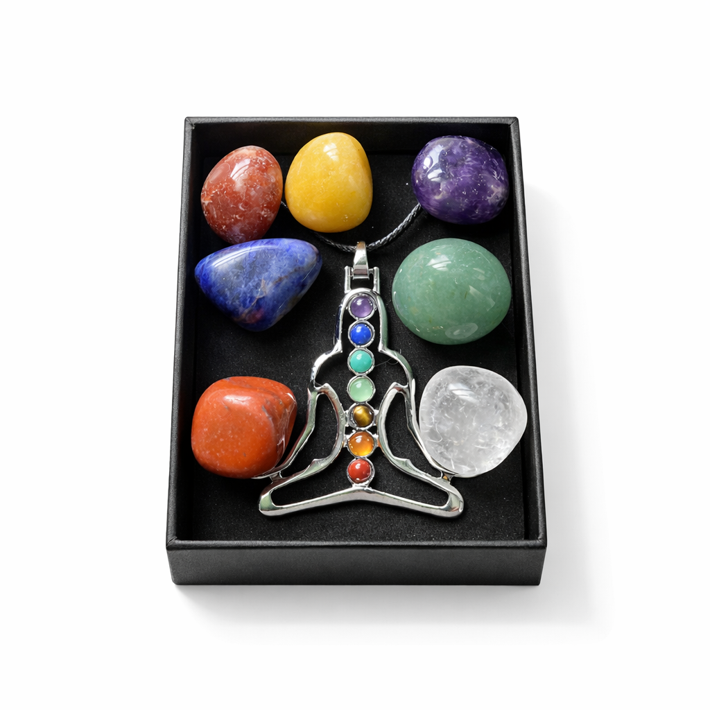 Chakra necklace with colorful stones in a black box on a white background