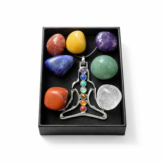 Chakra necklace with colorful stones in a black box on a white background