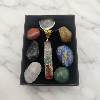 Pendant with stones in a black box on a white background